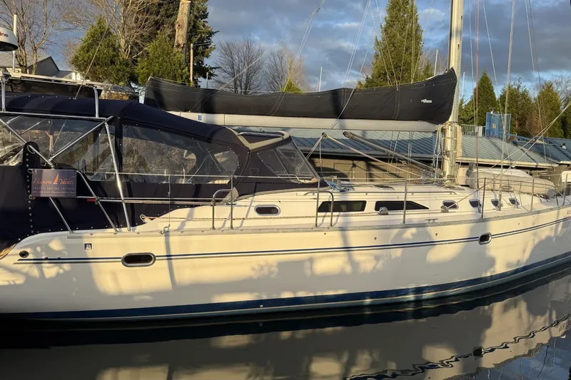  Yacht Photos Pics 2004 Catalina 470 sailboat docked, featuring sleek design and covered cockpit.