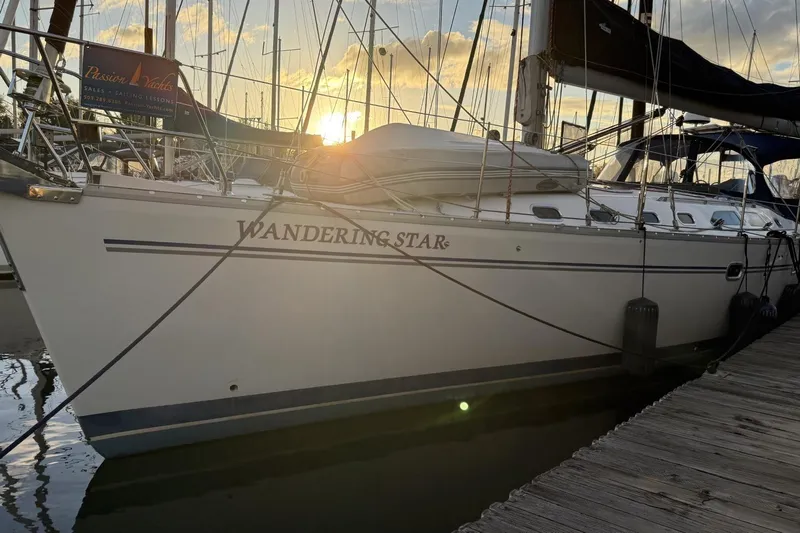  Yacht Photos Pics Catalina 470 sailboat "Wandering Star" docked at sunset, 2004 model.