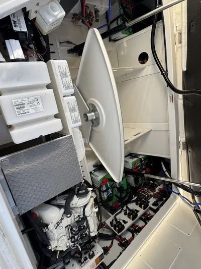  Yacht Photos Pics Engine compartment of 2024 Sea Ray Sundancer 320 Outboard, showcasing mechanical components and wiring.