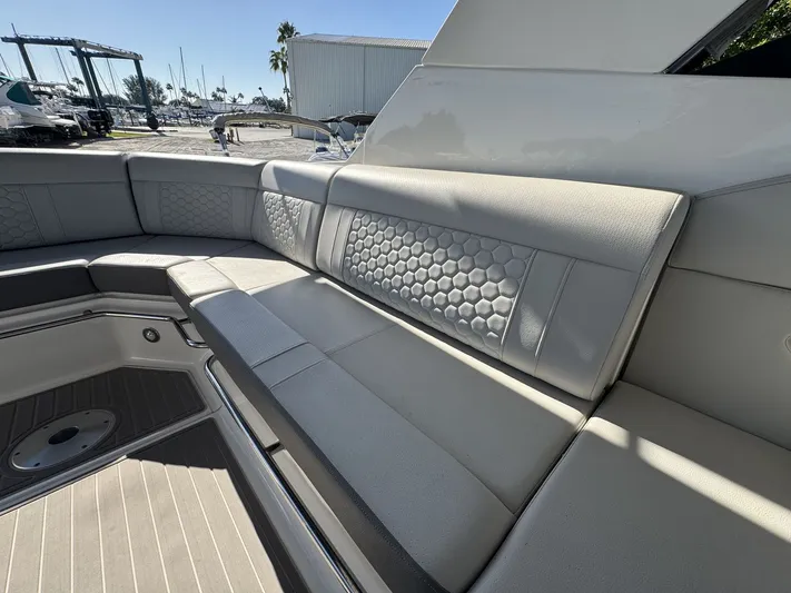  Yacht Photos Pics 2024 Sea Ray Sundancer 320 Outboard interior seating with hexagonal pattern upholstery.