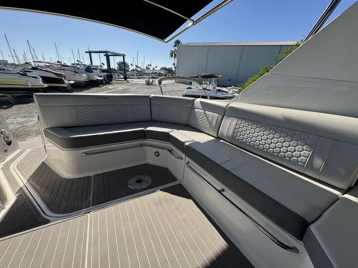  Yacht Photos Pics 2024 Sea Ray Sundancer 320 Outboard interior with luxurious seating and modern design.