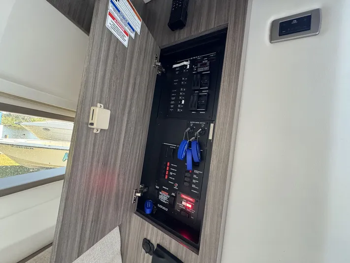  Yacht Photos Pics 2024 Sea Ray Sundancer 320 Outboard electrical panel with control switches and key fobs.