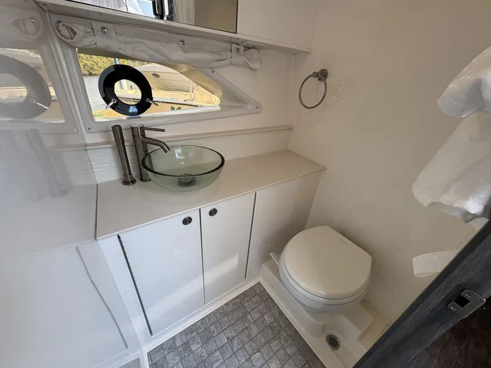  Yacht Photos Pics 2024 Sea Ray Sundancer 320 Outboard bathroom with modern sink and toilet.