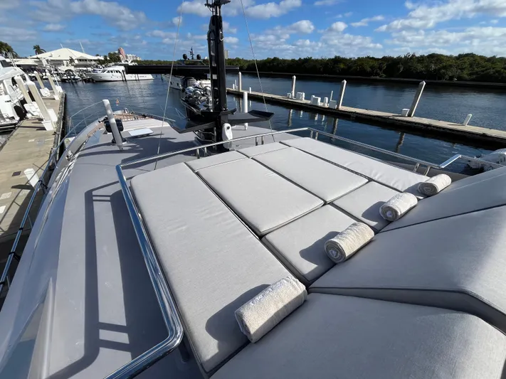 Izumi Yacht Photos Pics Luxurious 2008 Palmer Johnson 120 yacht with sunbathing deck, docked at marina.