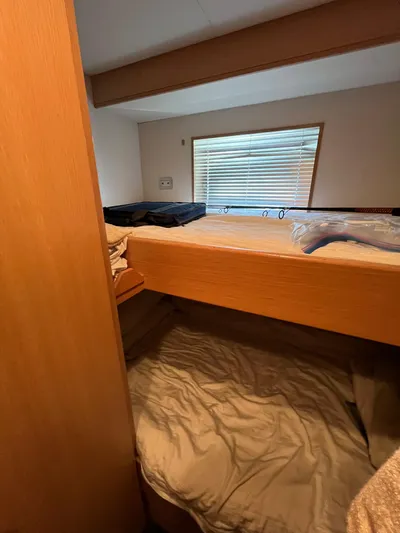 Izumi Yacht Photos Pics Bunk beds in a 2008 Palmer Johnson 120 yacht cabin with window blinds.