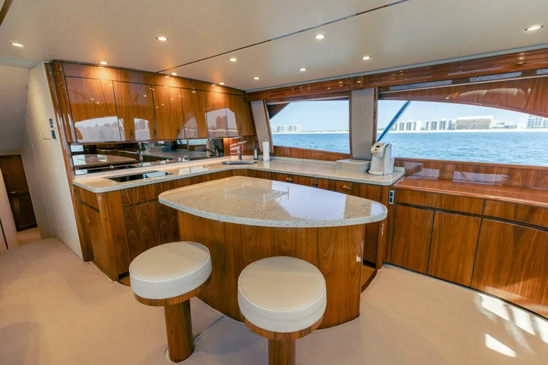 Da'grits Yacht Photos Pics Luxurious kitchen interior of 2018 Viking 62 Convertible yacht with ocean view.