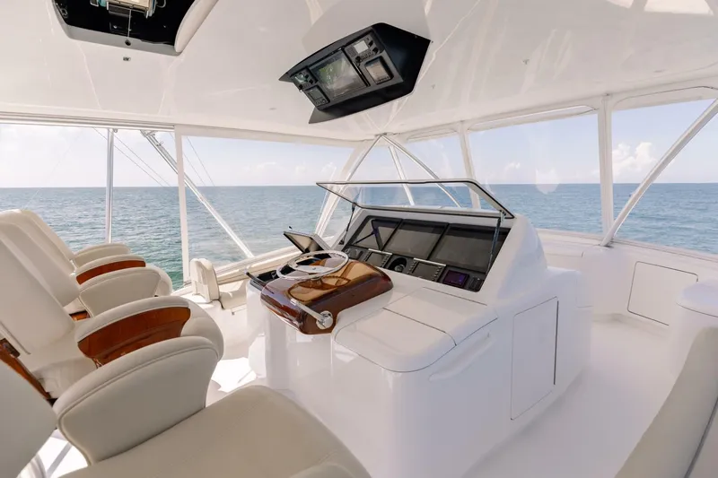 Da'grits Yacht Photos Pics Luxurious helm of 2018 Viking 62 Convertible yacht with ocean view.