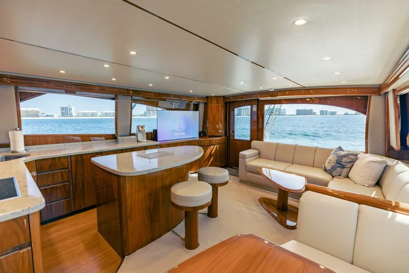 Da'grits Yacht Photos Pics Luxurious interior of 2018 Viking 62 Convertible yacht with ocean view and elegant furnishings.