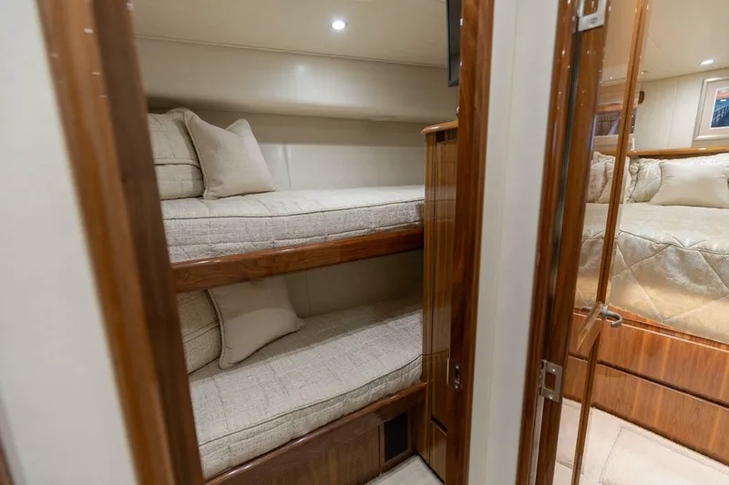 Da'grits Yacht Photos Pics Luxurious interior of 2018 Viking 62 Convertible yacht with cozy bunk beds.