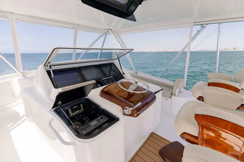 Da'grits Yacht Photos Pics Luxurious helm of 2018 Viking 62 Convertible yacht with ocean view.