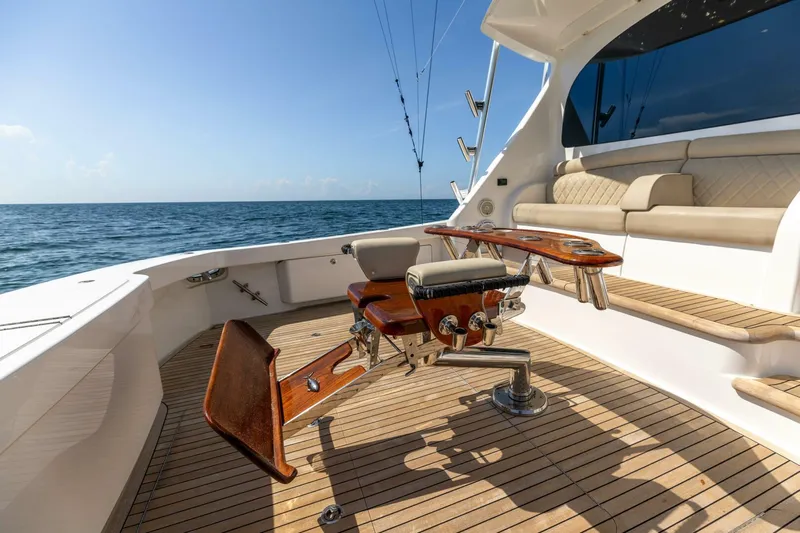 Da'grits Yacht Photos Pics 2018 Viking 62 Convertible yacht deck with fishing chair, ocean view, and seating area.