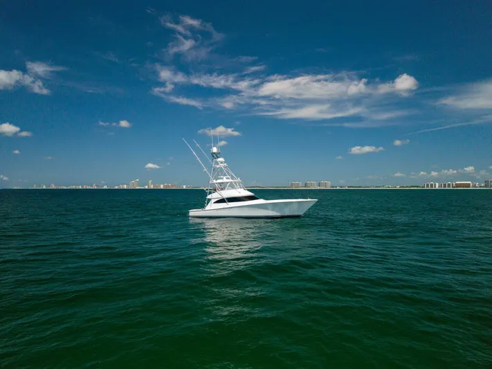 Da'grits Yacht Photos Pics 2018 Viking 62 Convertible yacht on open sea under clear blue sky.
