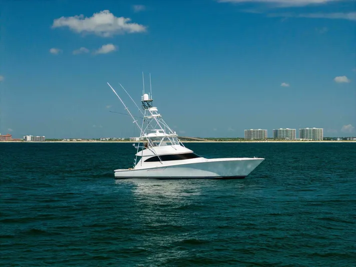Da'grits Yacht Photos Pics 2018 Viking 62 Convertible yacht cruising on open water under a clear blue sky.