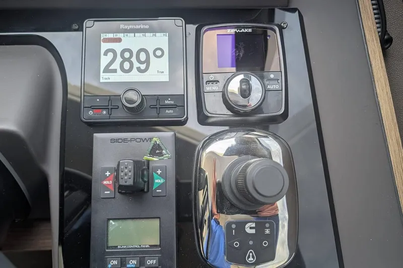  Yacht Photos Pics Control panel of a 2022 Prestige 590 yacht featuring navigation and joystick controls.