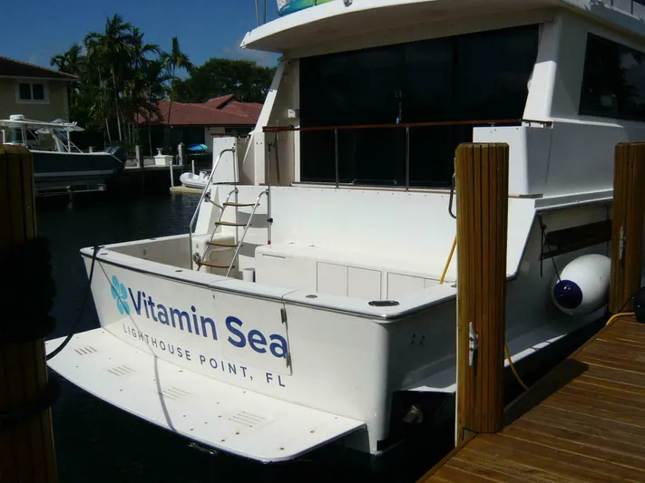 Vitamin Sea Yacht Photos Pics 1990 Viking Cockpit Motor Yacht docked at Lighthouse Point, FL, named "Vitamin Sea".