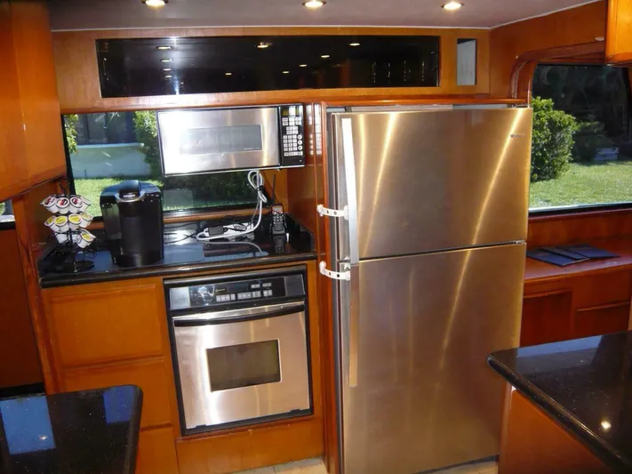 Vitamin Sea Yacht Photos Pics Modern kitchen in 1990 Viking Cockpit Motor Yacht with stainless steel appliances.