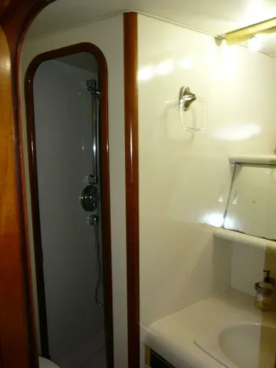 Vitamin Sea Yacht Photos Pics 1990 Viking Cockpit Motor Yacht bathroom with shower and sink.