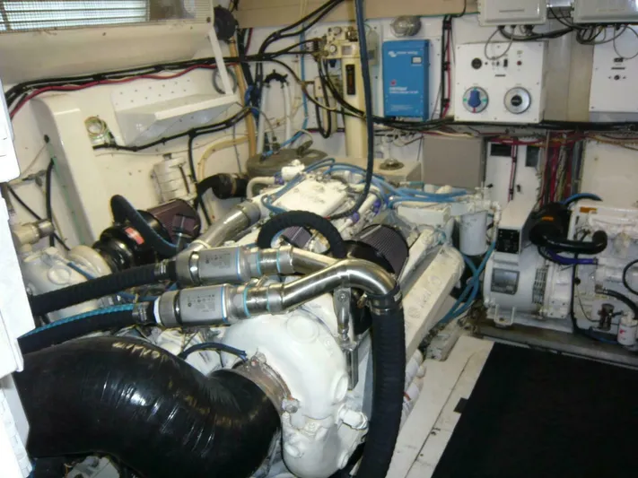 Vitamin Sea Yacht Photos Pics Engine room of a 1990 Viking Cockpit Motor Yacht, featuring complex machinery and wiring.