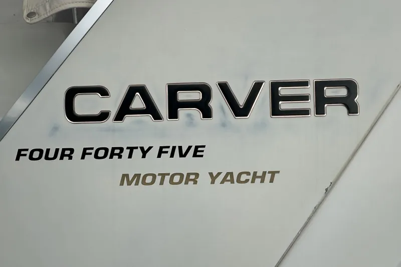  Yacht Photos Pics 1998 Carver 445 Aft Cabin Motor Yacht logo on hull.