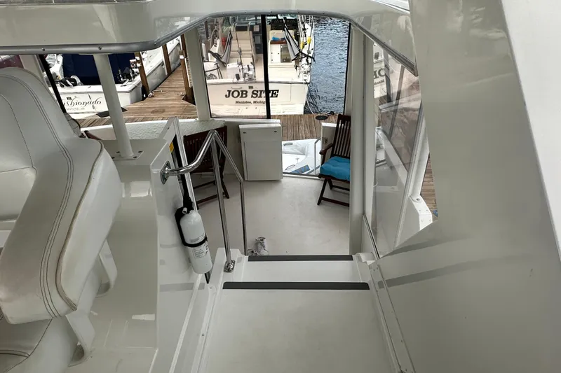  Yacht Photos Pics 1998 Carver 445 Aft Cabin Motor Yacht interior with dock view.