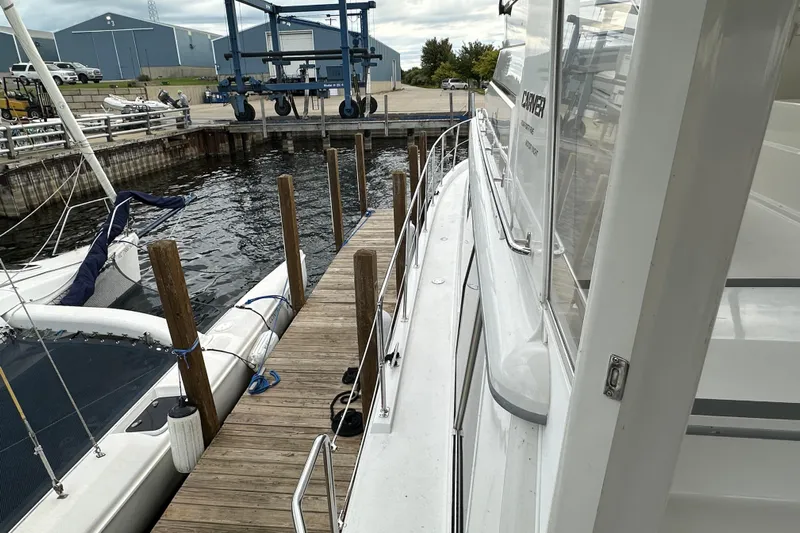  Yacht Photos Pics 1998 Carver 445 Aft Cabin Motor Yacht docked at marina with wooden pier.