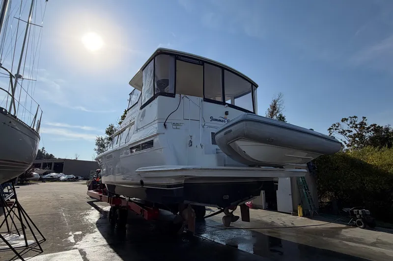  Yacht Photos Pics 1998 Carver 445 Aft Cabin Motor Yacht on dry dock under sunny sky.