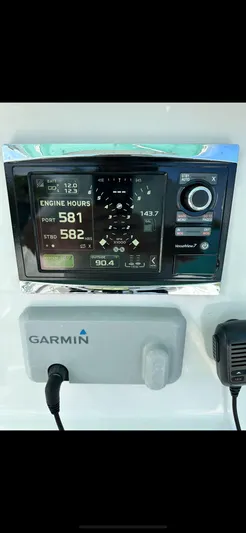  Yacht Photos Pics Garmin marine display on 2016 Contender 28 Sport, showing engine hours and navigation data.