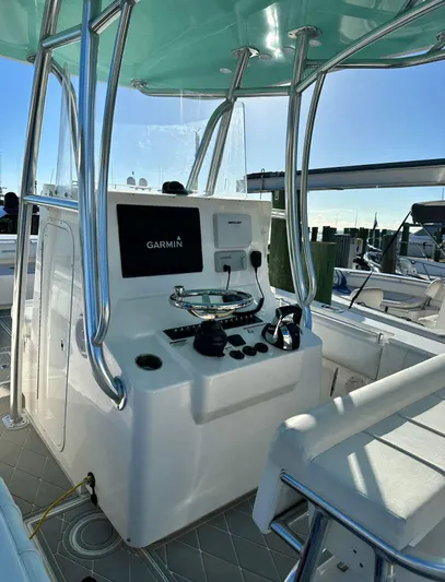  Yacht Photos Pics 2016 Contender 28 Sport boat console with Garmin navigation system and sleek design.