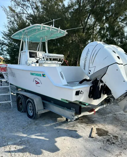 Yacht Photos Pics 2016 Contender 28 Sport boat on trailer, featuring dual outboard engines.