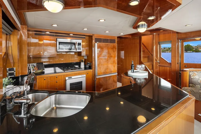 Coconut Yacht Photos Pics Luxurious kitchen interior of 2009 Ocean Alexander 74 Flybridge Motoryacht with modern amenities.