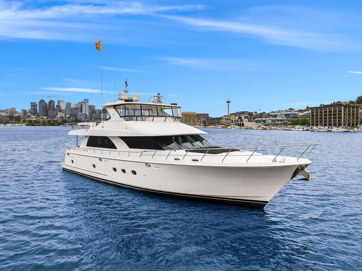 Coconut Yacht Photos Pics 2009 Ocean Alexander 74 Flybridge Motoryacht cruising near city skyline.