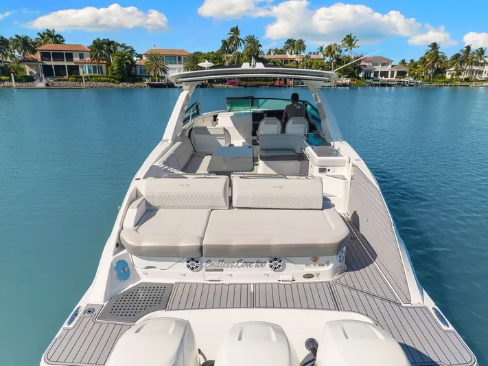  Yacht Photos Pics 2020 Sea Ray 400 SLX Outboard cruising on a serene, tropical waterway.