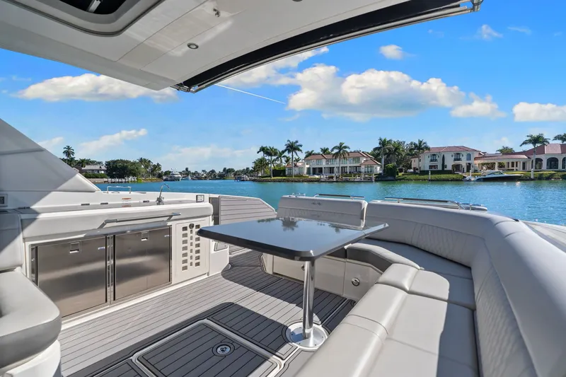  Yacht Photos Pics 2020 Sea Ray 400 SLX Outboard yacht interior with luxurious seating and waterfront view.