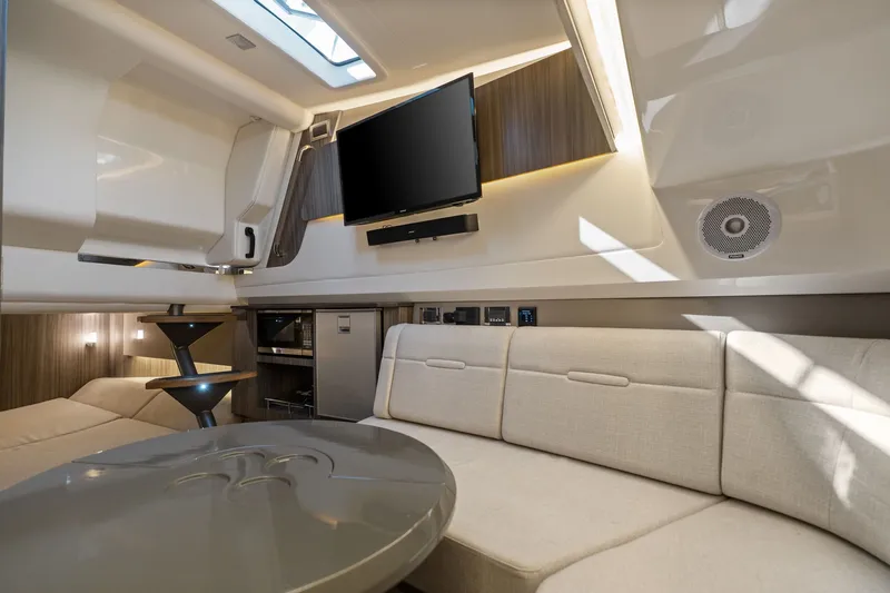  Yacht Photos Pics Luxurious interior of 2020 Sea Ray 400 SLX Outboard with modern seating and entertainment system.