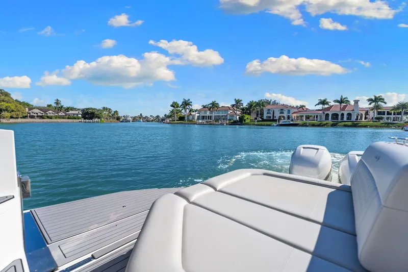  Yacht Photos Pics 2020 Sea Ray 400 SLX Outboard cruising on a scenic waterfront with luxury homes.