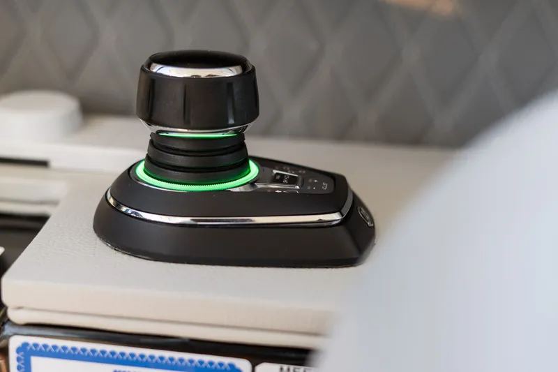  Yacht Photos Pics Joystick control on 2020 Sea Ray 400 SLX Outboard boat, featuring sleek design and green lighting.