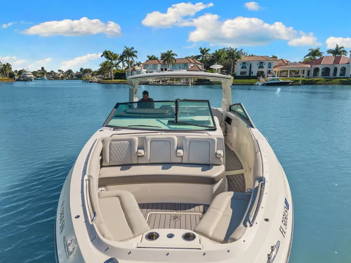  Yacht Photos Pics 2020 Sea Ray 400 SLX Outboard cruising on a sunny day near luxury waterfront homes.