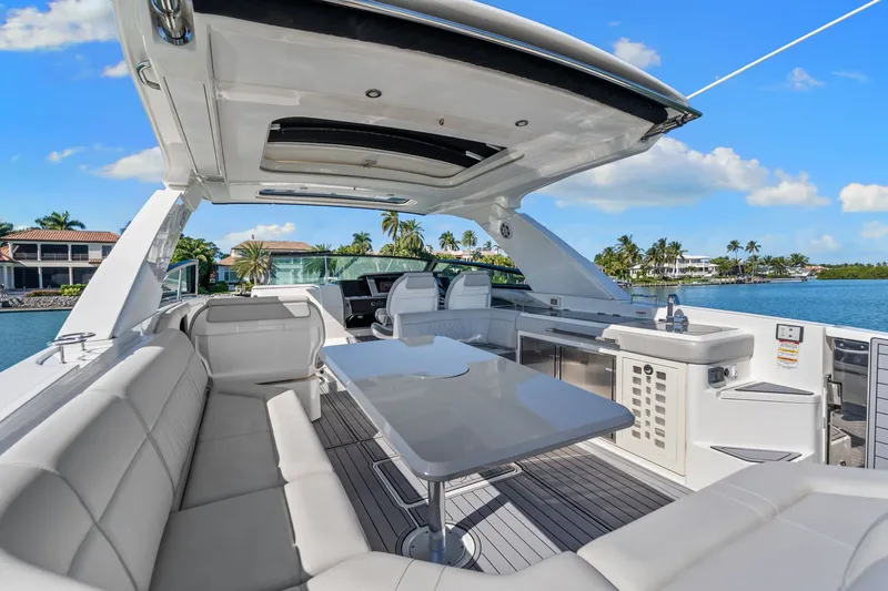  Yacht Photos Pics Luxurious 2020 Sea Ray 400 SLX Outboard yacht interior with spacious seating and scenic waterfront view.