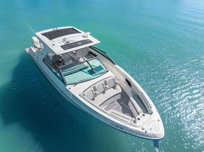  Yacht Photos Pics 2020 Sea Ray 400 SLX Outboard cruising on clear blue water.