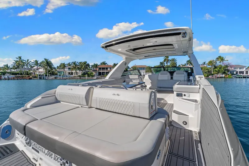  Yacht Photos Pics 2020 Sea Ray 400 SLX Outboard luxury boat on serene water with palm trees.