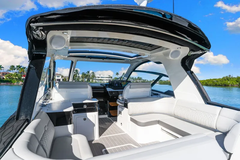  Yacht Photos Pics 2020 Sea Ray 400 SLX Outboard interior with luxurious seating and scenic water view.
