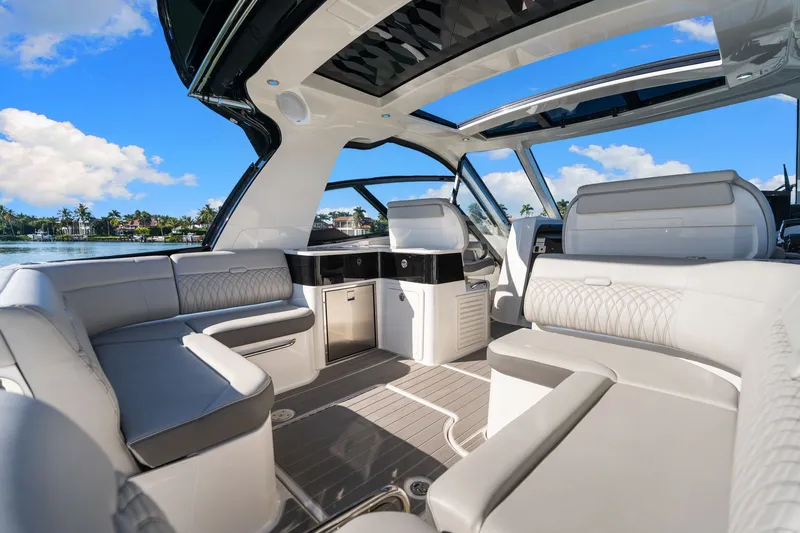  Yacht Photos Pics Luxurious interior of 2020 Sea Ray 400 SLX Outboard boat with elegant seating and open roof.