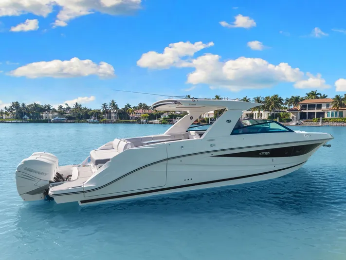  Yacht Photos Pics 2020 Sea Ray 400 SLX Outboard boat on calm blue water, clear sky background.