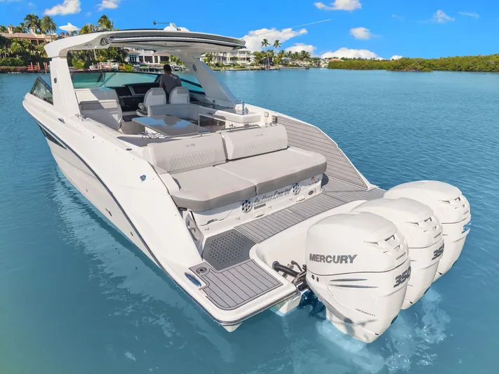  Yacht Photos Pics 2020 Sea Ray 400 SLX Outboard boat on clear blue water, featuring triple Mercury engines.