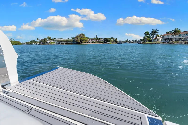  Yacht Photos Pics 2020 Sea Ray 400 SLX Outboard on serene water with scenic shoreline view.