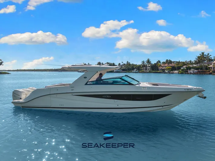 Yacht Photos Pics 2020 Sea Ray 400 SLX Outboard boat on calm water under a clear blue sky.