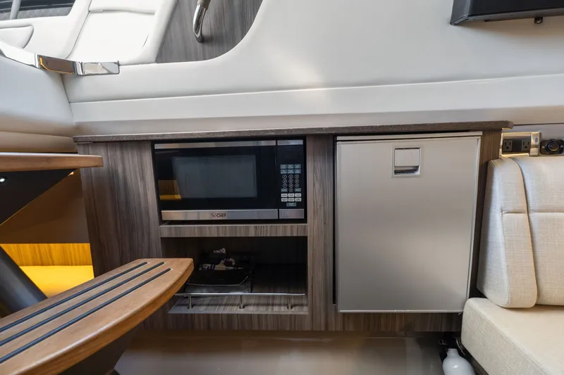  Yacht Photos Pics Interior of 2020 Sea Ray 400 SLX Outboard with microwave and fridge.