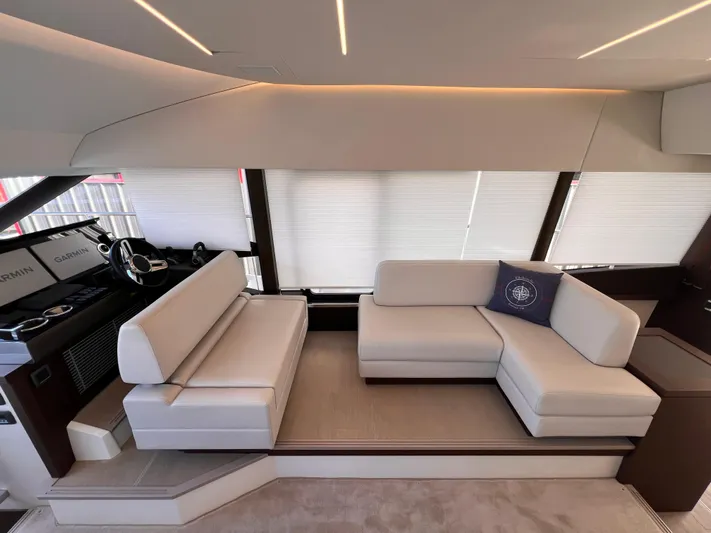  Yacht Photos Pics Luxurious interior of a 2023 Prestige 520 yacht with modern seating and helm station.