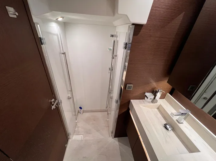  Yacht Photos Pics Modern bathroom in 2023 Prestige 520 yacht, featuring sleek design and elegant fixtures.