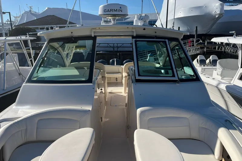  Yacht Photos Pics 2015 Grady-White Freedom 375 boat with Garmin equipment, docked in a marina.